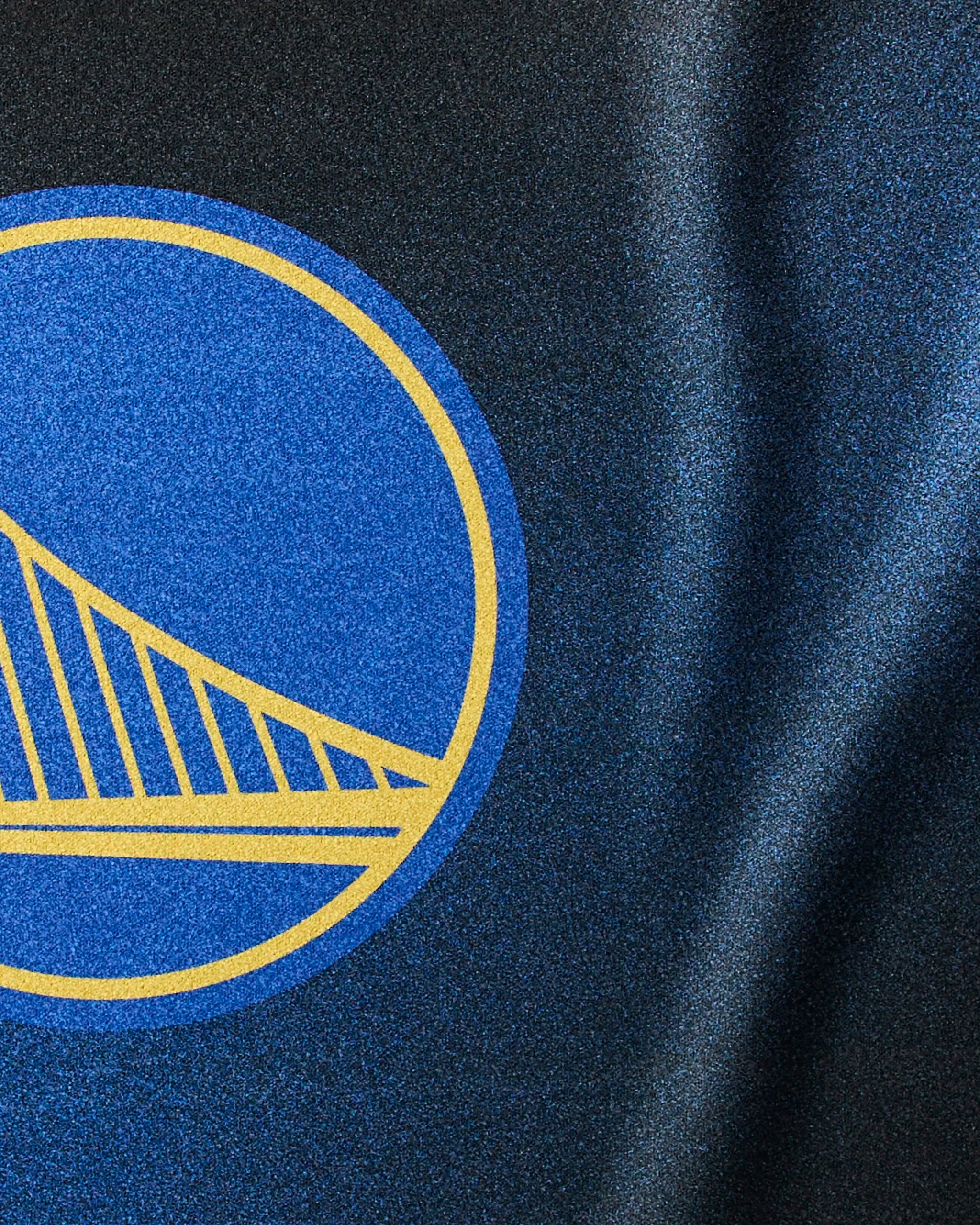 Close-up of the Geometry Warriors Fade sustainable workout towel, showcasing a yellow outline of the Golden Gate Bridge on a blue circle background, inspired by the Golden State Warriors basketball team.