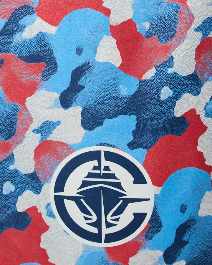 The Clippers Camo beach towel by NBALAB x Geometry features a blue, red, and white abstract camo pattern with a stylized ship logo and is eco-friendly—quick-drying and made from recycled materials, perfect for the shore.