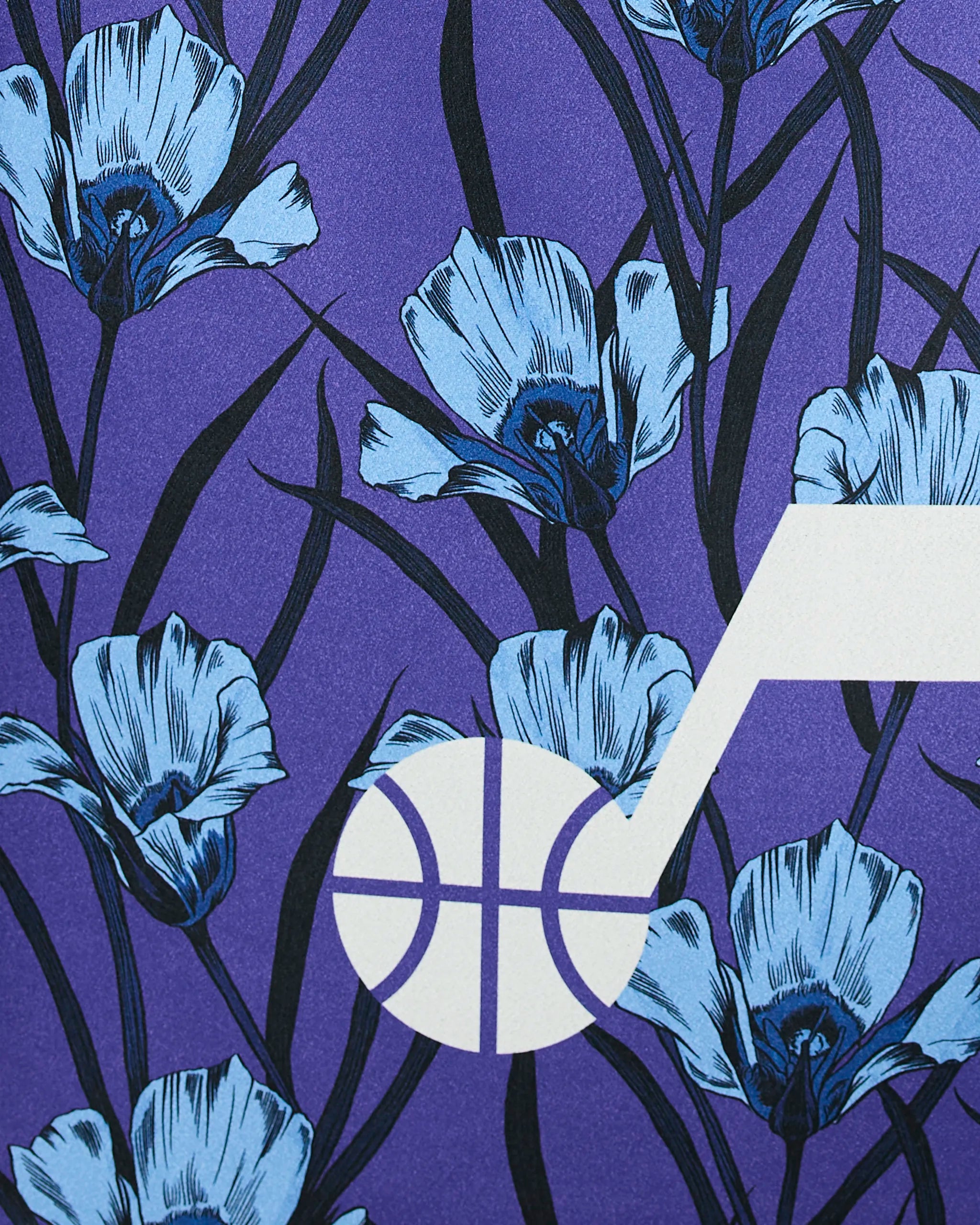 The Jazz Floral by Geometry features a white basketball and hoop over a purple background with blue iris flowers and dark leaves.