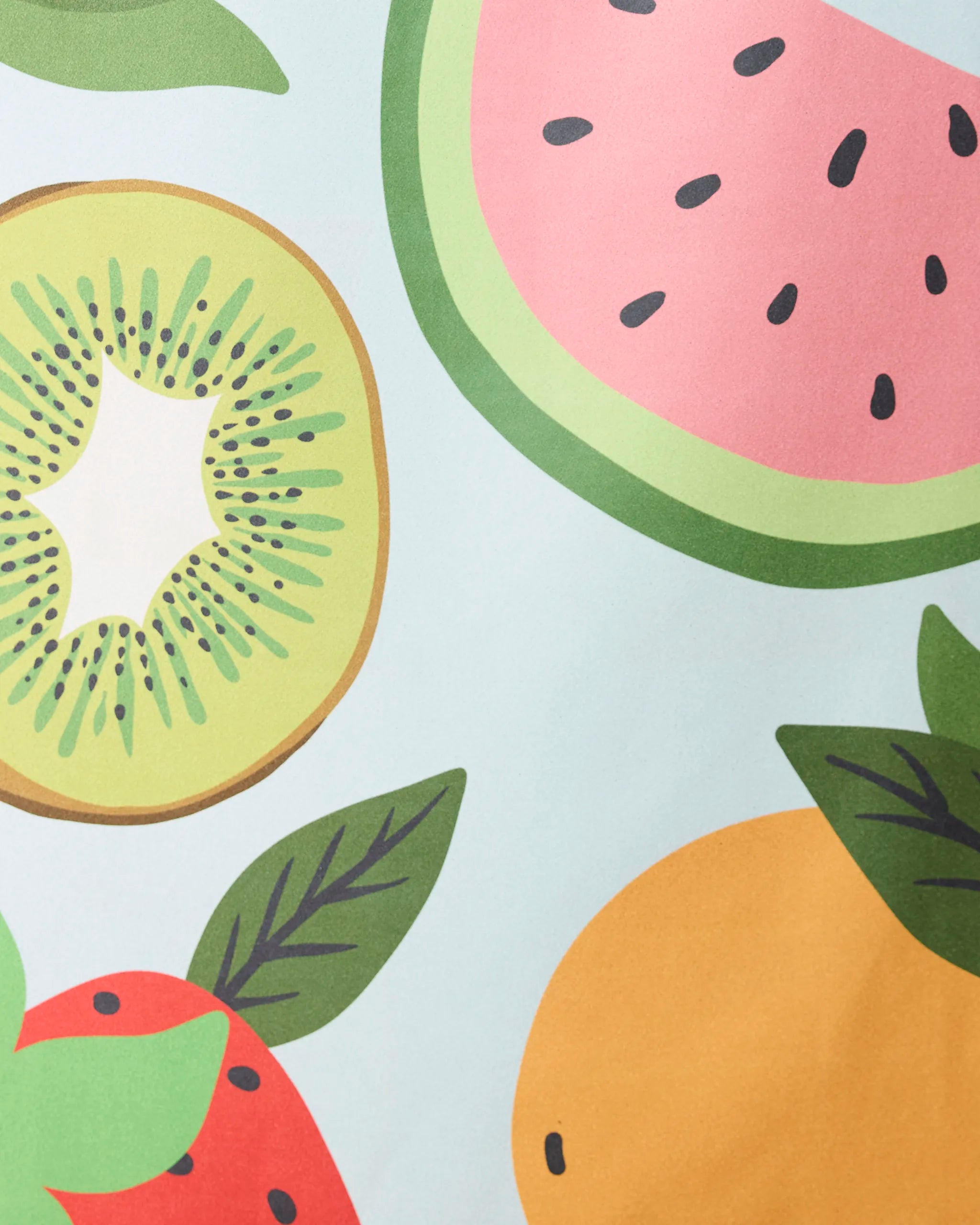 The GEOMETRY Fruit Salad quick-drying beach towel features a playful illustration of sliced kiwi, watermelon, and orange with green leaves on a light blue background. Made from recycled materials for a fresh, eco-friendly touch.