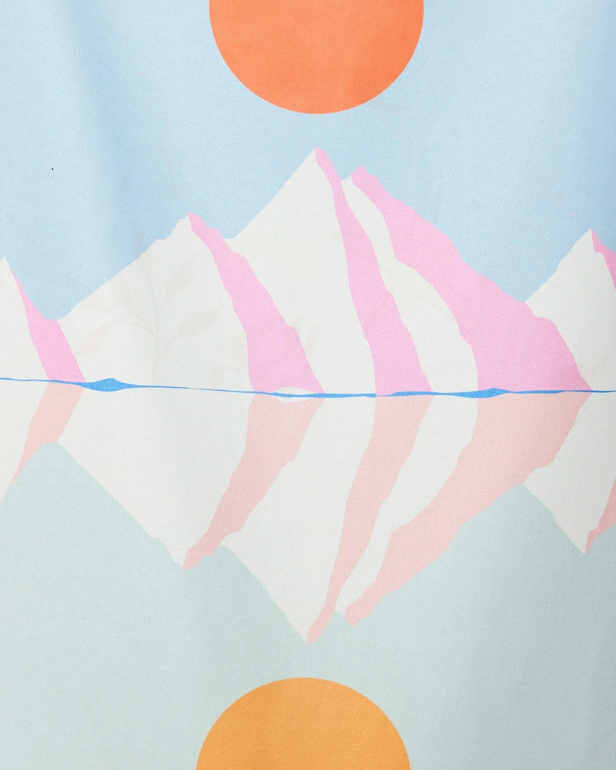 Elevated by GEOMETRY features a minimalist illustration of pink and white mountains reflected in water under a blue sky, accented by large orange circles, adding an abstract pastel flair to any quick-drying beach towel.
