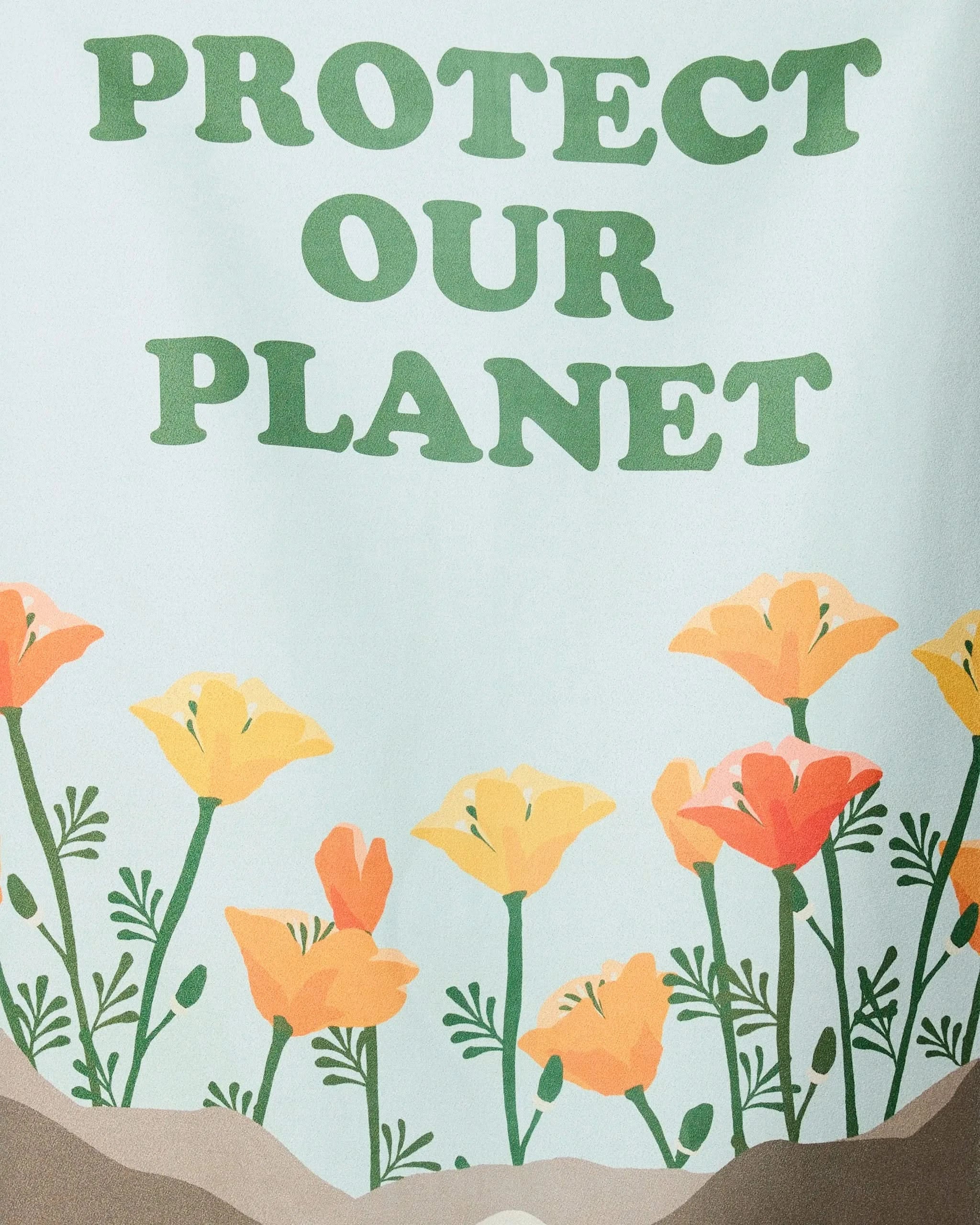 The Protect beach towel by GEOMETRY features PROTECT OUR PLANET in green above orange and yellow flowers on a light background, crafted from recycled materials—ideal for eco-conscious style.
