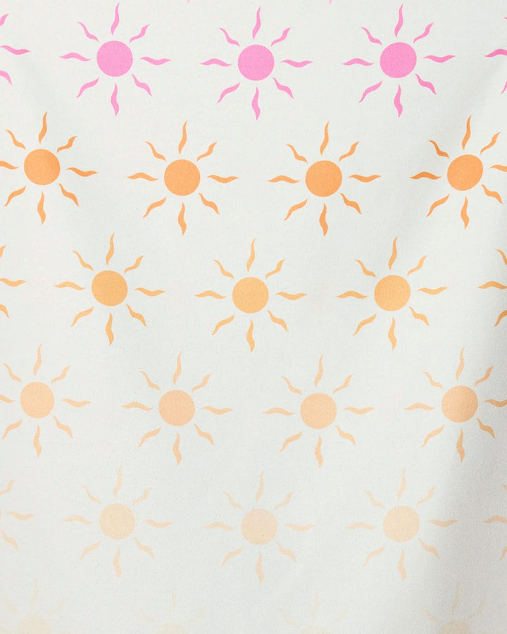 The GEOMETRY Fun in the Sun micro-loop beach towel features rows of sun shapes in pink and orange fading from top to bottom on white. Made with recycled materials, its quick-drying design is perfect for sunny days.