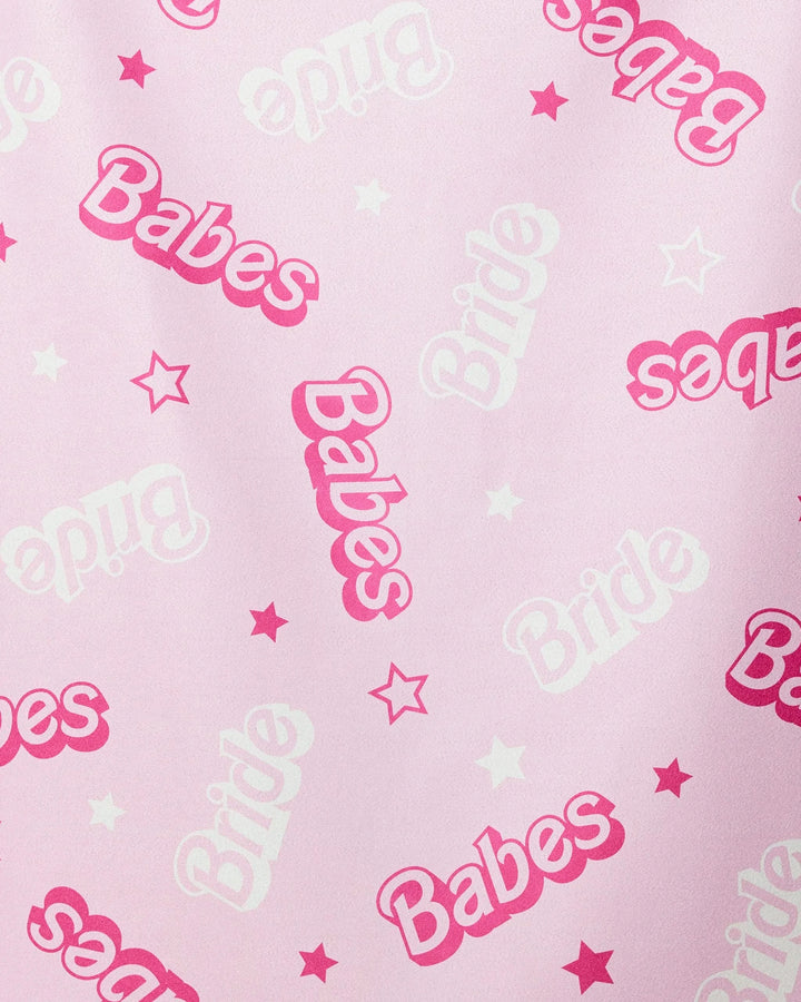 The Lets Go Party beach towel by GEOMETRY features a pink background with playful white and pink Bride and Babes lettering plus small stars—a quick-drying, fun accessory for your bridal party.