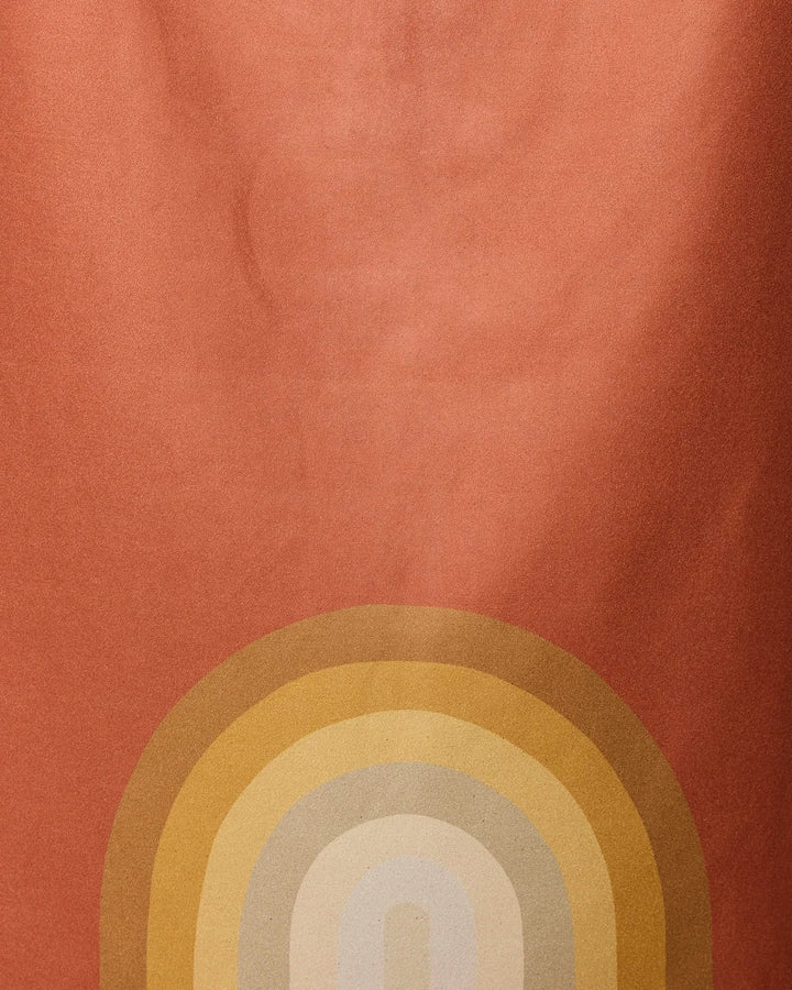The Pumpkin Spice beach towel by GEOMETRY features an abstract design on a reddish-orange background with yellow, gold, and beige arcs—crafted from recycled materials for fast drying.