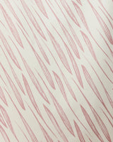 Light pink, elongated leaf-like shapes repeat diagonally on a beige background in the Calm Winds Micro-loop Beach Towel by GEOMETRY. Made from recycled materials, it delivers quick-drying performance and eco-friendly style.