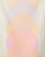 The Funky Phases beach towel by GEOMETRY features a soft geometric pattern of overlapping translucent circles in pastel hues and offers quick-drying performance.