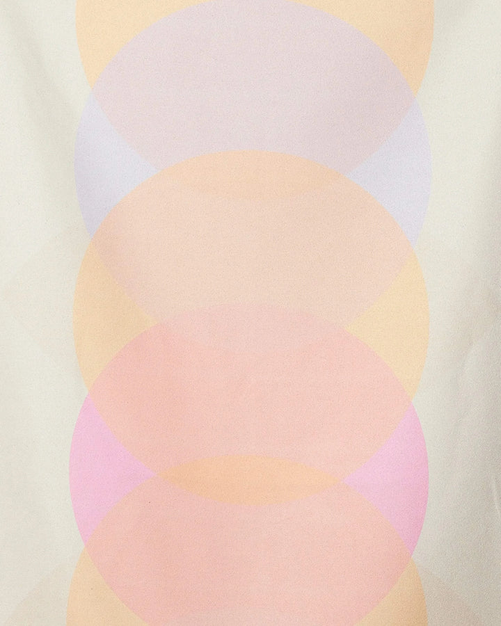 The Funky Phases beach towel by GEOMETRY features a soft geometric pattern of overlapping translucent circles in pastel hues and offers quick-drying performance.