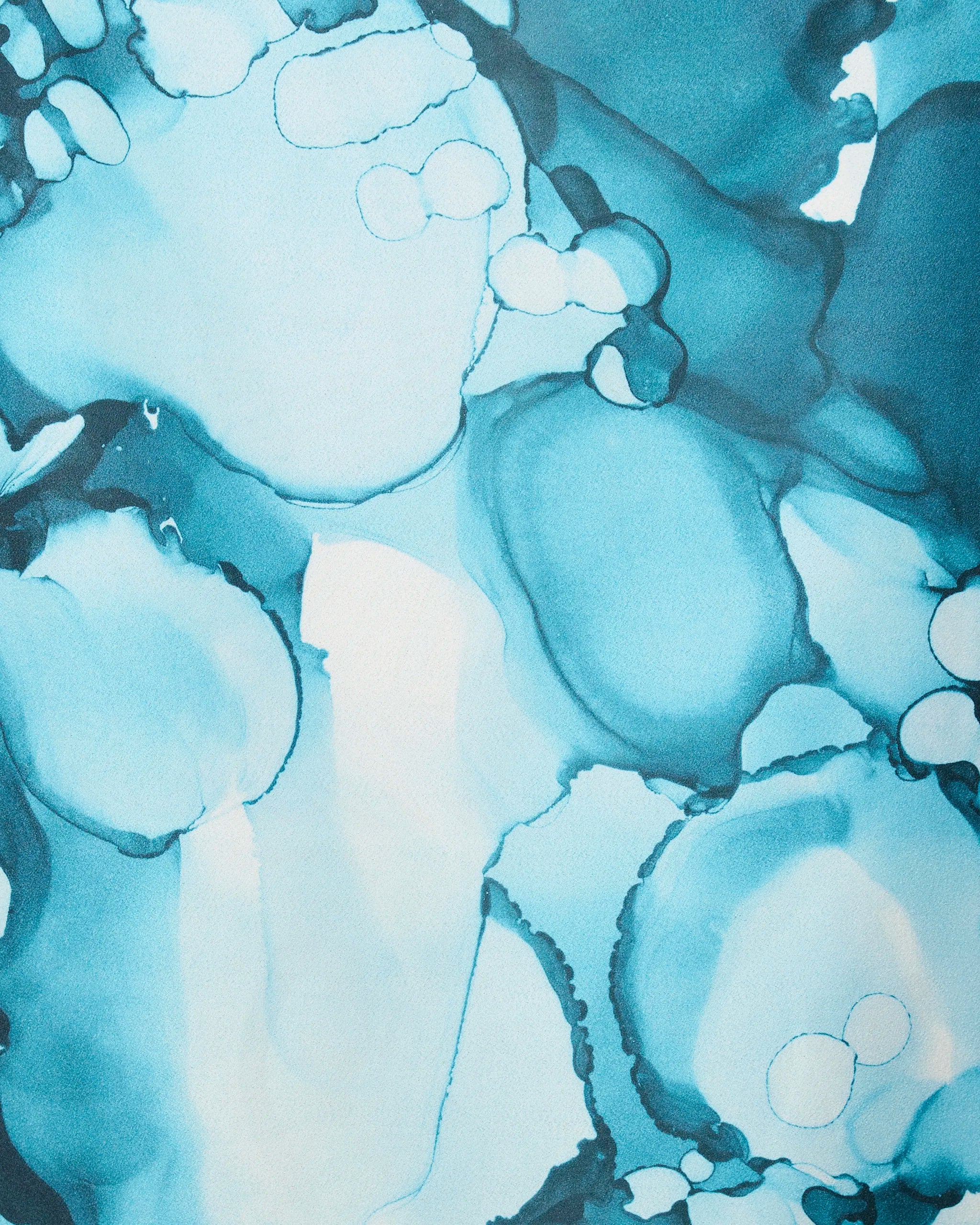 Leah by GEOMETRY: Inspired by abstract watercolor art with overlapping blue and teal shapes, this calming, quick-drying beach towel is crafted from recycled materials for sustainable style.