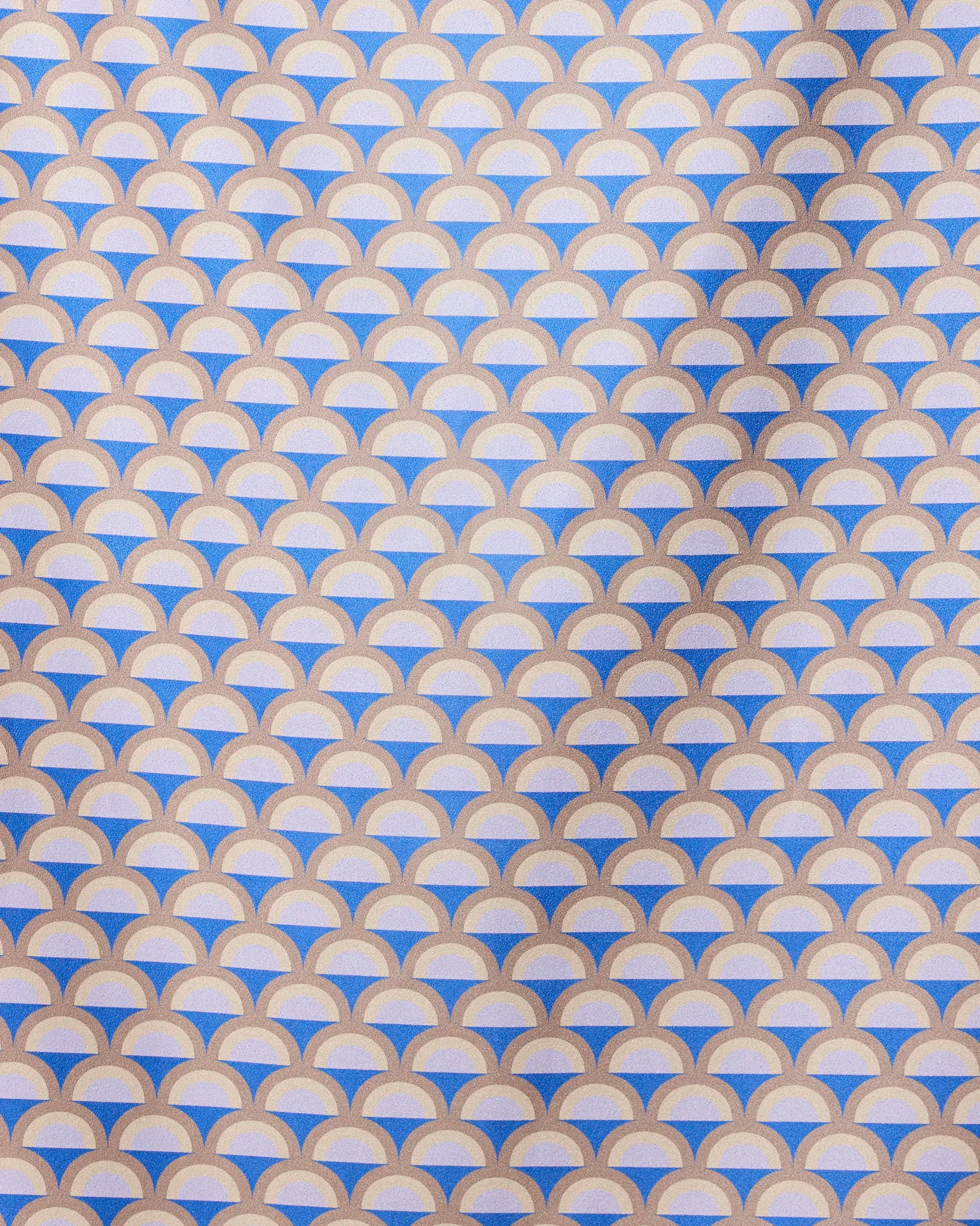 A repeating geometric pattern of overlapping mauve, beige, and white semicircles forms a scallop design on the GEOMETRY Mauve Mounds quick-drying beach towel, with diagonal shadows highlighting its textured surface.