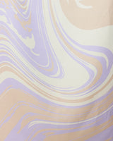 The GEOMETRY Way Out Wave beach towel features a quick-drying fabric with an abstract, soft pastel marble pattern in lavender, beige, and cream swirls.