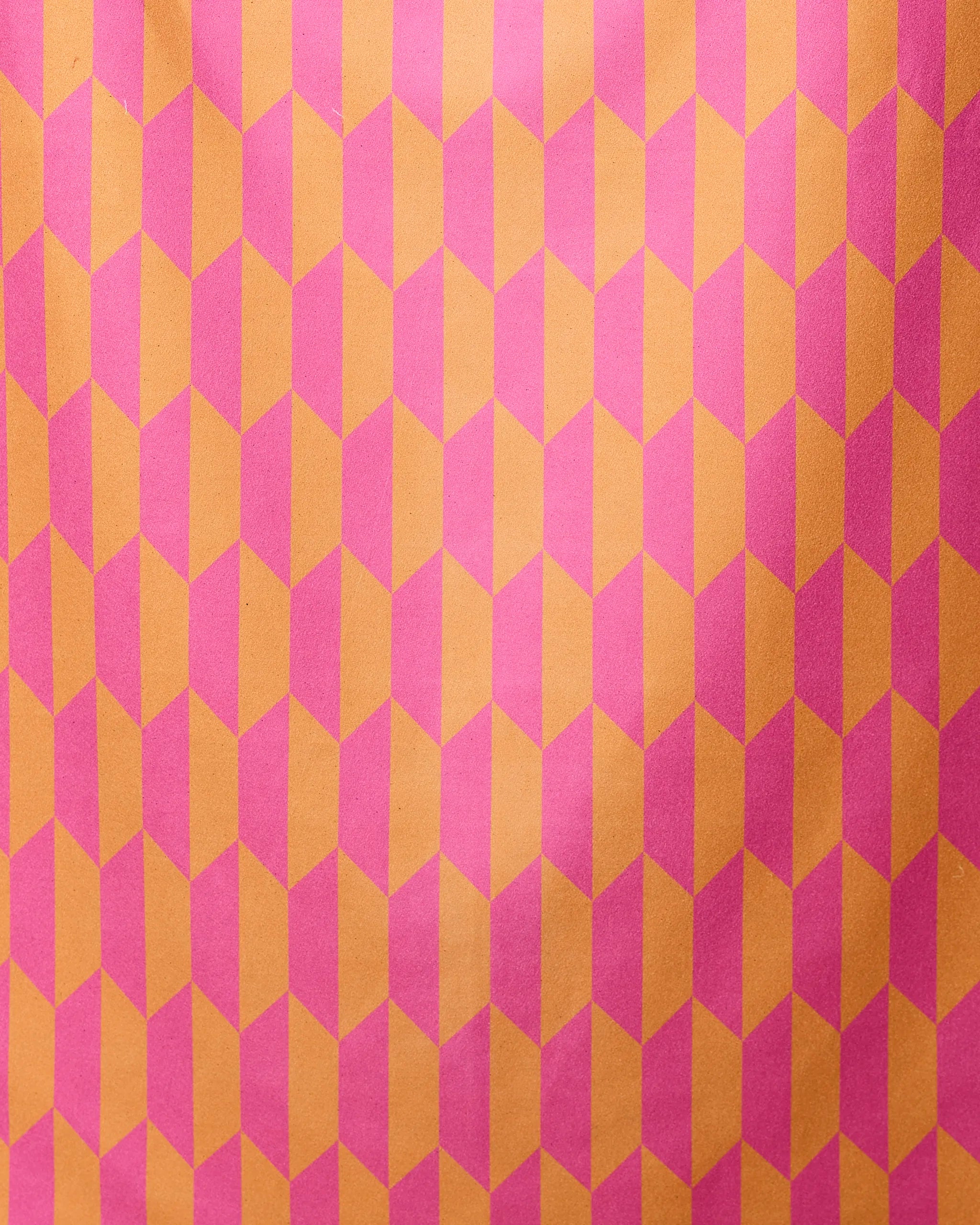 The GEOMETRY Bright Trapezoid micro-loop beach towel features a bold, repeating pink and orange trapezoid pattern for a vibrant 3D effect—both stylish and functional for your next beach outing.