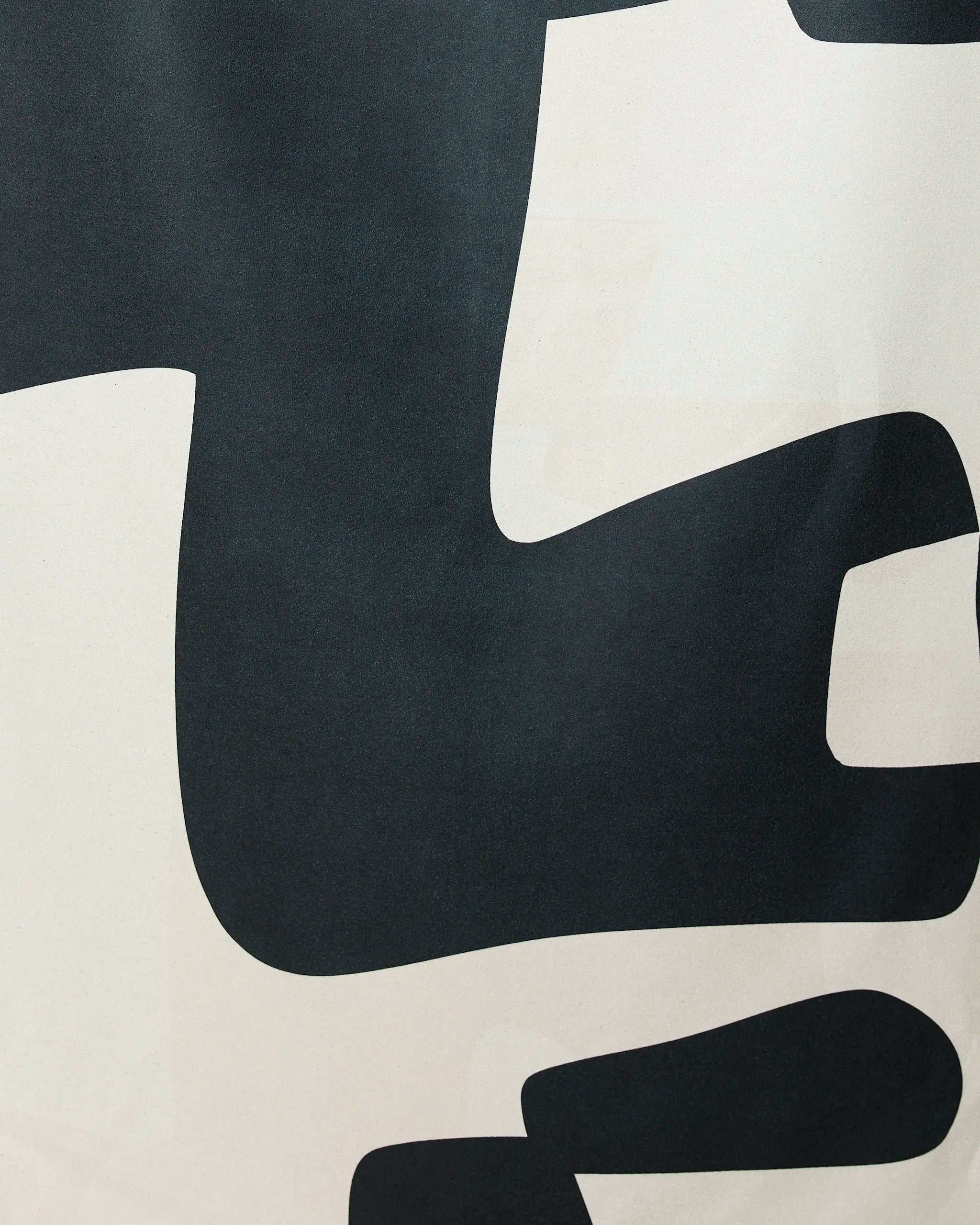 Abstract Neutral by GEOMETRY features a modern minimalist design of large, smooth-edged black and white shapes on a light background—ideal for the Geometry Micro-loop Beach Towel.