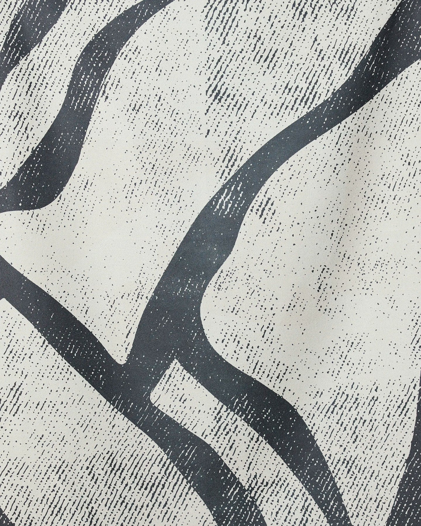 Abstract black wavy lines and dotted textures flow across an off-white background, inspired by the organic patterns of the GEOMETRY Block Beach Towel made from recycled materials.