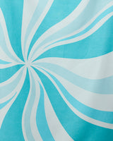 Radiating white and light blue swirls create motion and depth on the GEOMETRY Candy Blue Micro-loop Beach Towel. Made from recycled materials, this quick-drying towel features a smooth, visually dynamic abstract design.