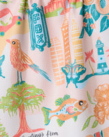 “Greetings From Georgia” by Geometry features a colorful watercolor illustration of birds, fish, butterflies, trees, flowers, a lighthouse, buildings, and a vintage FOX theater sign on an ultra-absorbent tea towel made from recycled materials.