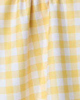 Close-up of the GEOMETRY Lemon Gingham recycled kitchen towel, featuring yellow and white gingham pattern with small textured squares and gentle folds.