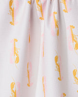 Close-up of GEOMETRYs Lobster Love kitchen towel, featuring a white textured fabric with an orange and pink lobster pattern. Made from recycled materials, the towel is gathered at the top to create gentle folds.