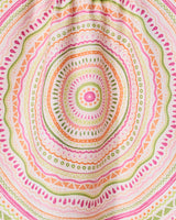 Bohemian Spring by GEOMETRY features a colorful mandala pattern with concentric circles and geometric shapes in pink, orange, green, and yellow on a quick-drying tea towel made from recycled materials.