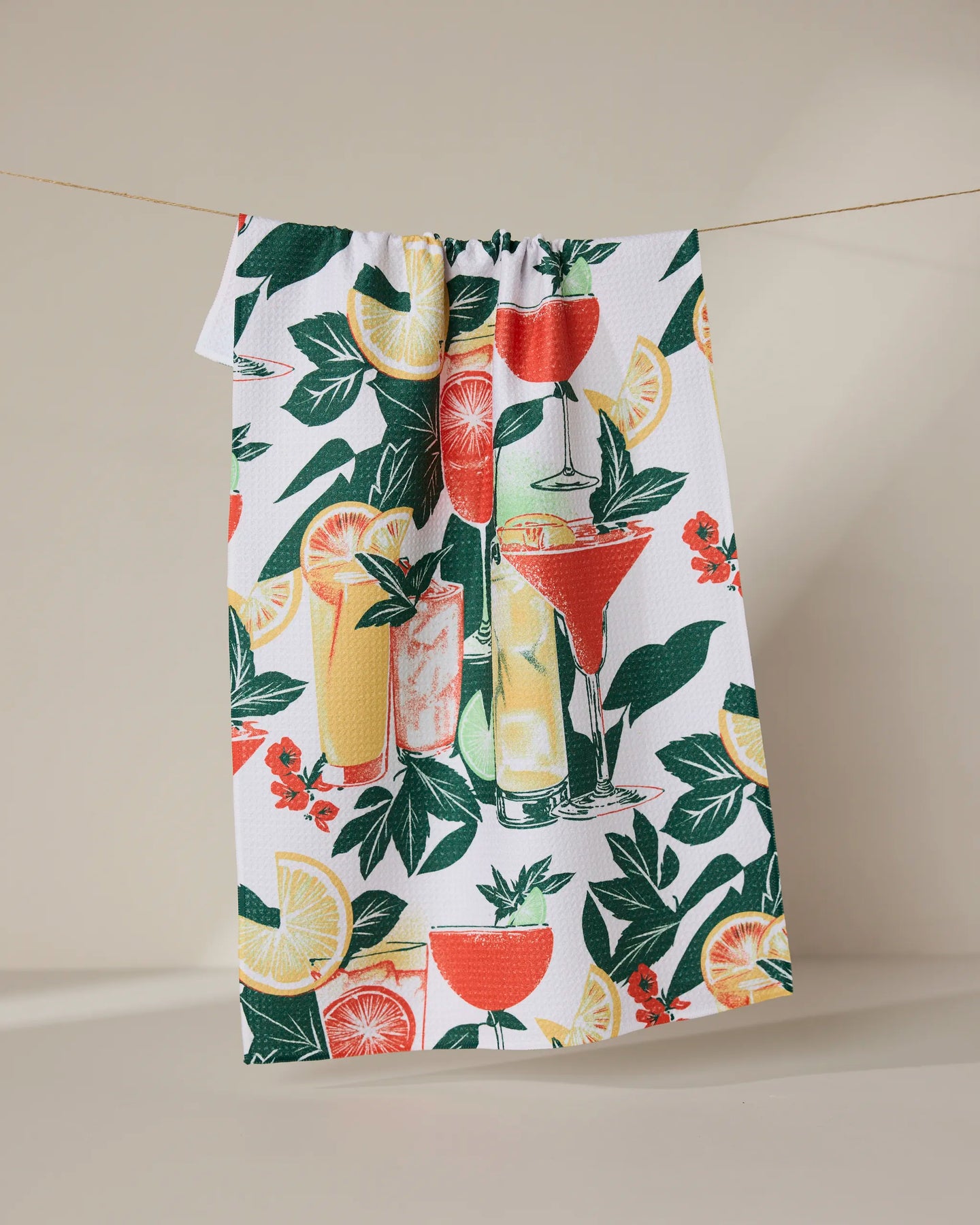 The Summer Refreshments recycled kitchen towel by Geometry features vibrant cocktails, citrus fruits, and green foliage on a white background for a colorful, eco-friendly touch.