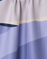Close-up of GEOMETRYs Mountainous curtain, showcasing gathered recycled fabric with textured horizontal stripes in blue, lavender, and pale yellow.