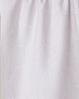 Close-up of the Geometry Posh Petals Blushed Bergamot tea towel, featuring a light pink and white wavy textured pattern with gathered folds, crafted from recycled materials.
