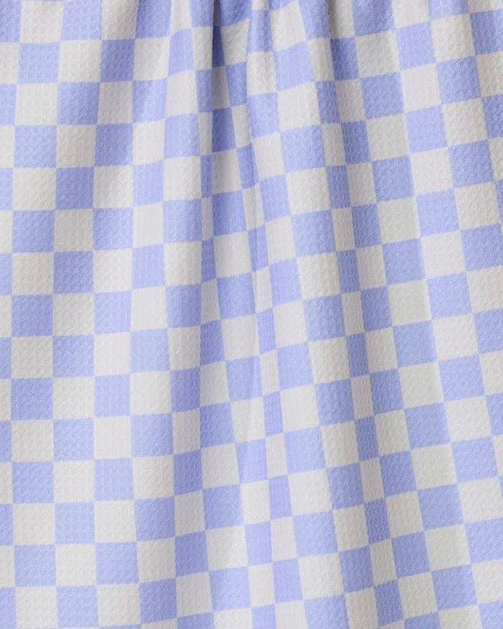 Close-up of Purple Picnic by GEOMETRY, featuring purple and white gingham checkered fabric with a textured surface and gentle folds—perfect for an ultra-absorbent tea towel in any kitchen.