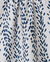 The Reeds Printed - Midnight tea towel by GEOMETRY features ultra-absorbent white fabric with a geometric, navy leaf-like pattern and elegant texture—perfect as a stylish addition to any kitchen.