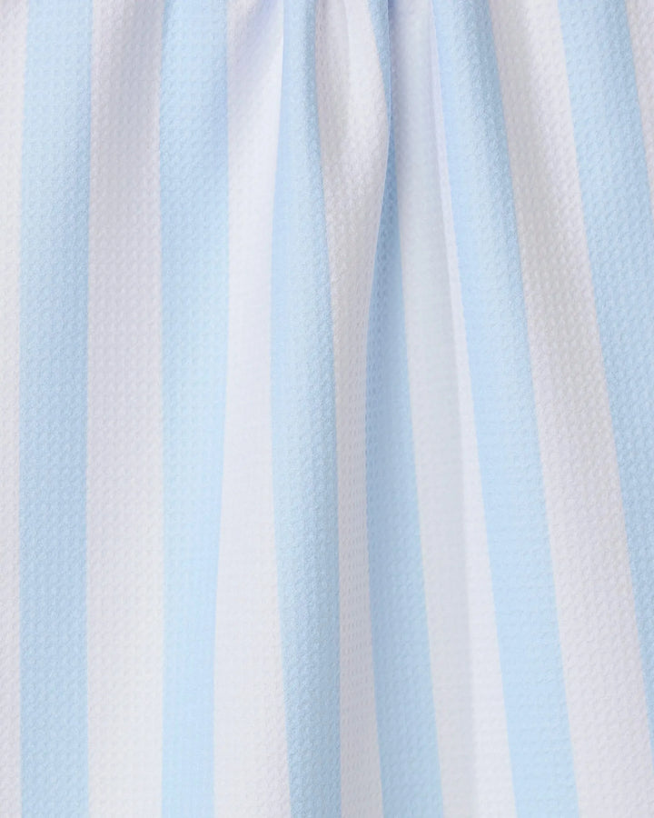 Close-up of the GEOMETRY Seaside Stripes recycled kitchen towel, showcasing its light blue and white vertical stripes, textured surface, and gentle folds.