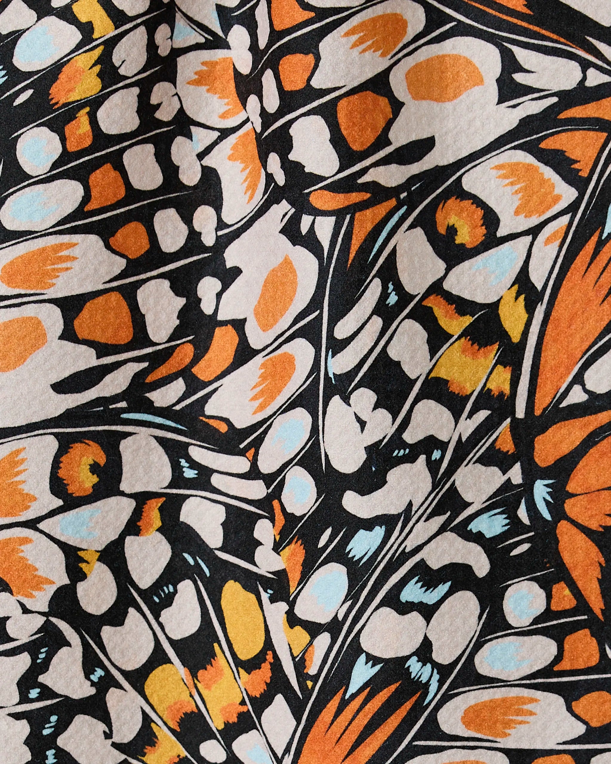 A close-up of GEOMETRY’s Wings in the Wind fabric, featuring butterflies and crafted from recycled materials.