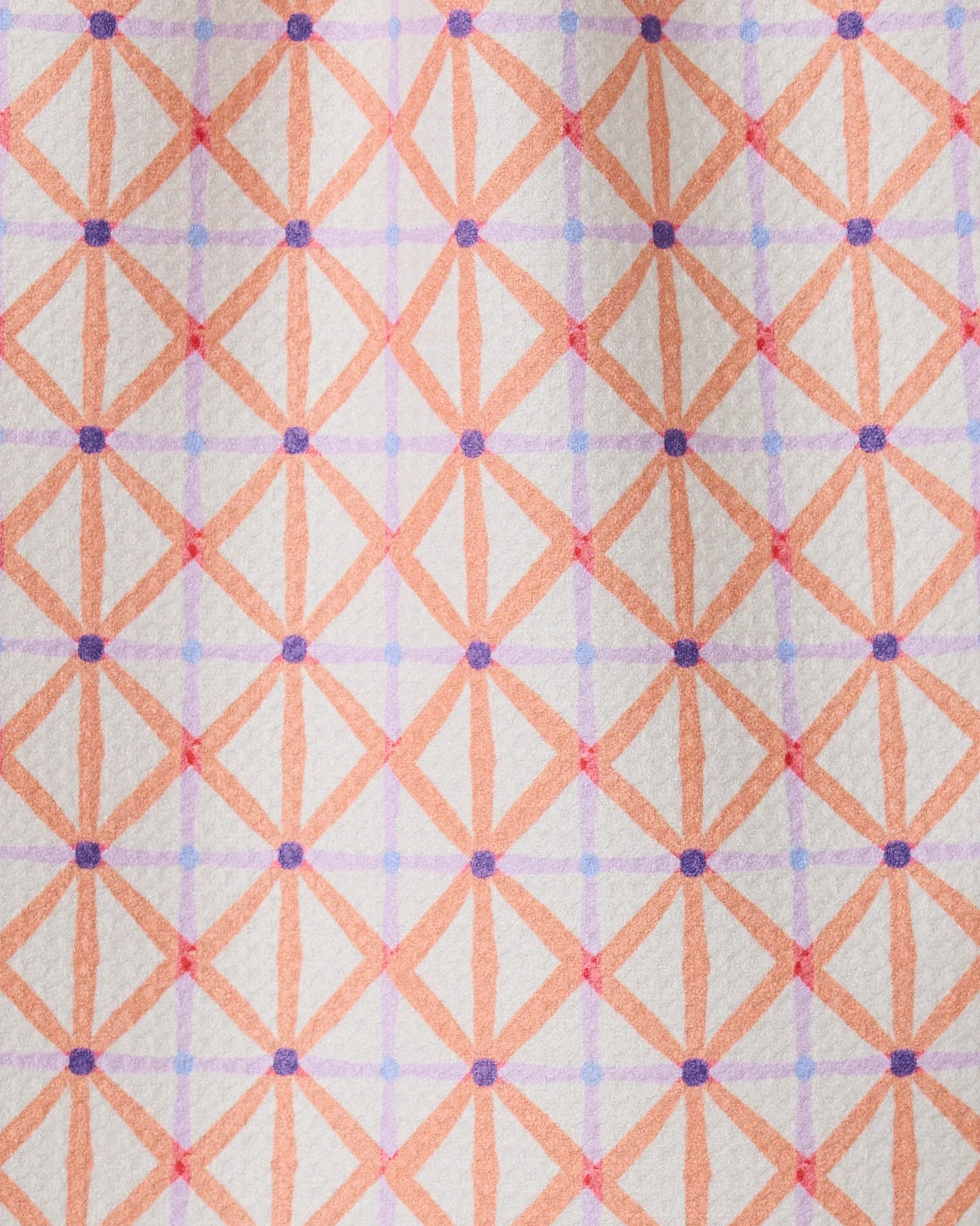 Anew by GEOMETRY is a patterned bar towel with intersecting orange and pink lines forming diamond shapes, accented by purple dots on a light background. Made from recycled materials for an eco-friendly touch.