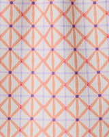 Anew by GEOMETRY is a patterned bar towel with intersecting orange and pink lines forming diamond shapes, accented by purple dots on a light background. Made from recycled materials for an eco-friendly touch.