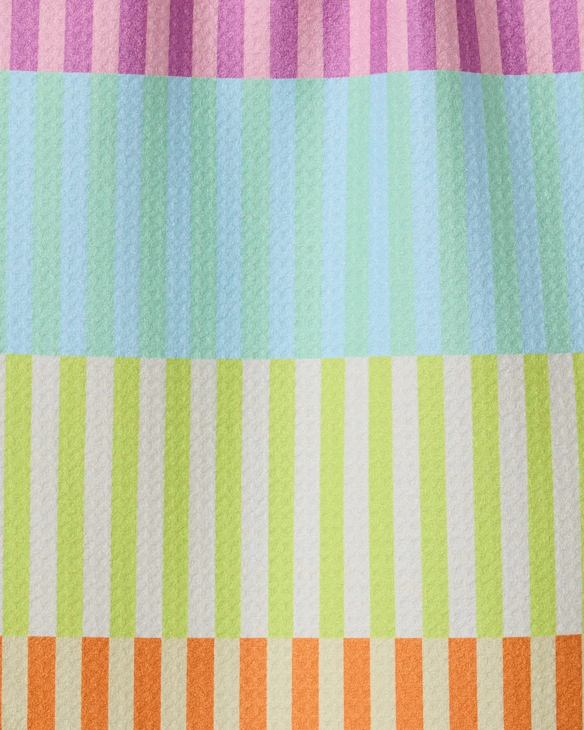 A close-up of the GEOMETRY Neon Nights towel, featuring ultra-absorbent fabric with pastel pink, blue, green, and orange horizontal stripes. Each band has alternating light and dark vertical accents for a modern kitchen style.