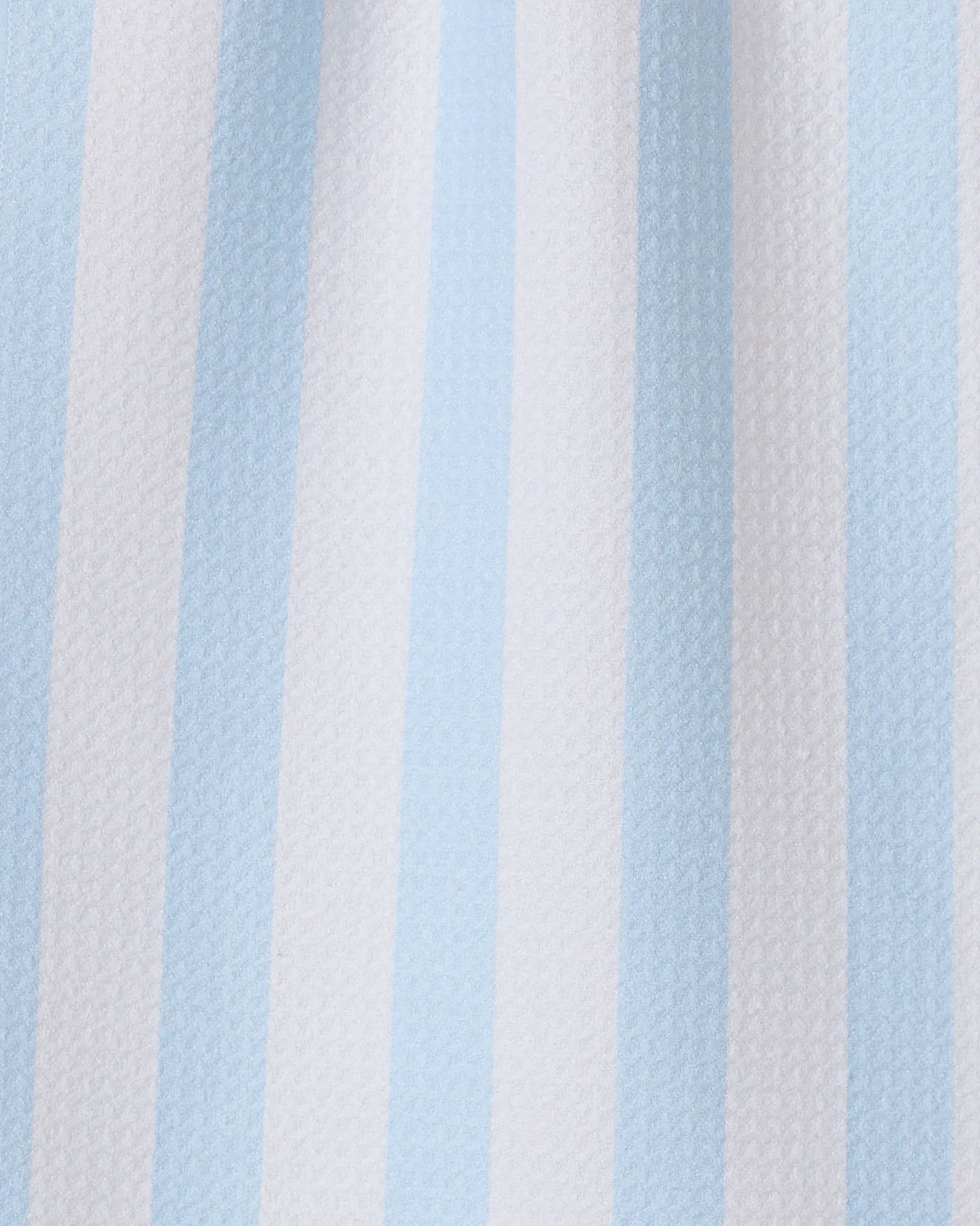 The GEOMETRY Seaside Stripes towel features vertical alternating pale blue and white stripes on textured fabric, making it a stylish and quick-drying choice for any kitchen.
