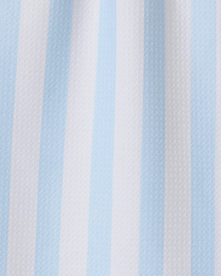The GEOMETRY Seaside Stripes towel features vertical alternating pale blue and white stripes on textured fabric, making it a stylish and quick-drying choice for any kitchen.