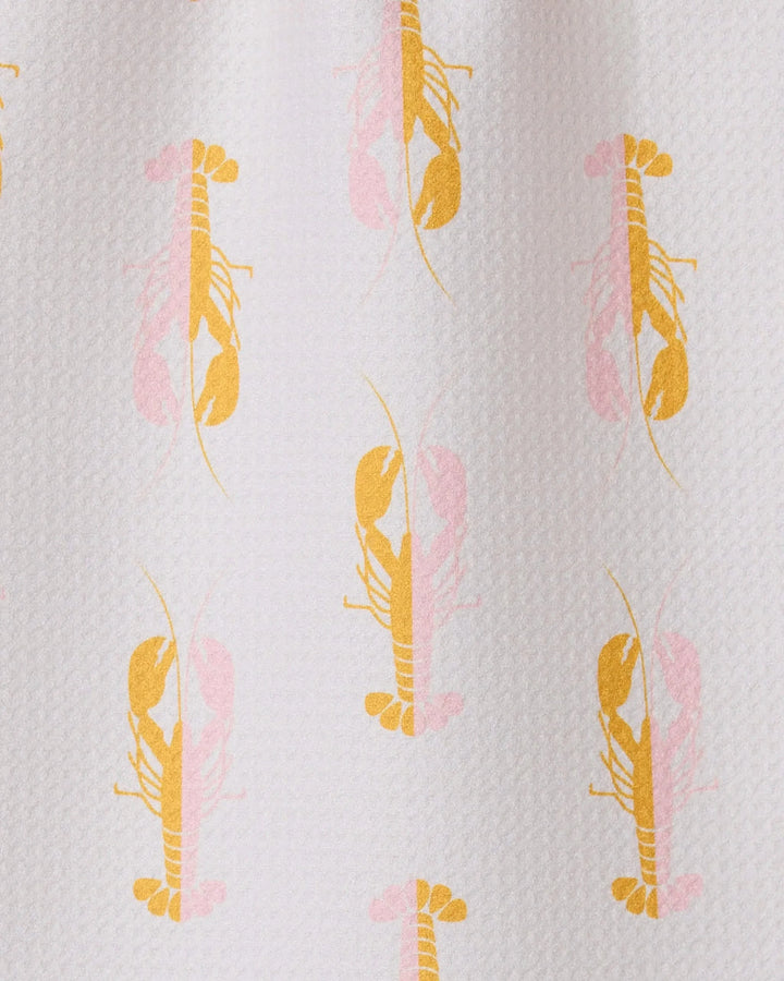 The GEOMETRY Lobster Love bar towel is textured white, made from recycled materials, and features a playful repeat pattern of yellow and light pink lobsters facing both up and down in alternating rows.