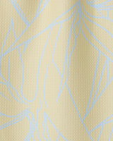 Close-up of Paradise Blooms by GEOMETRY—a textured, light beige towel featuring abstract blue lines. The ultra-absorbent, wavy surface with subtle shadows highlights its soft, high-quality fabric.