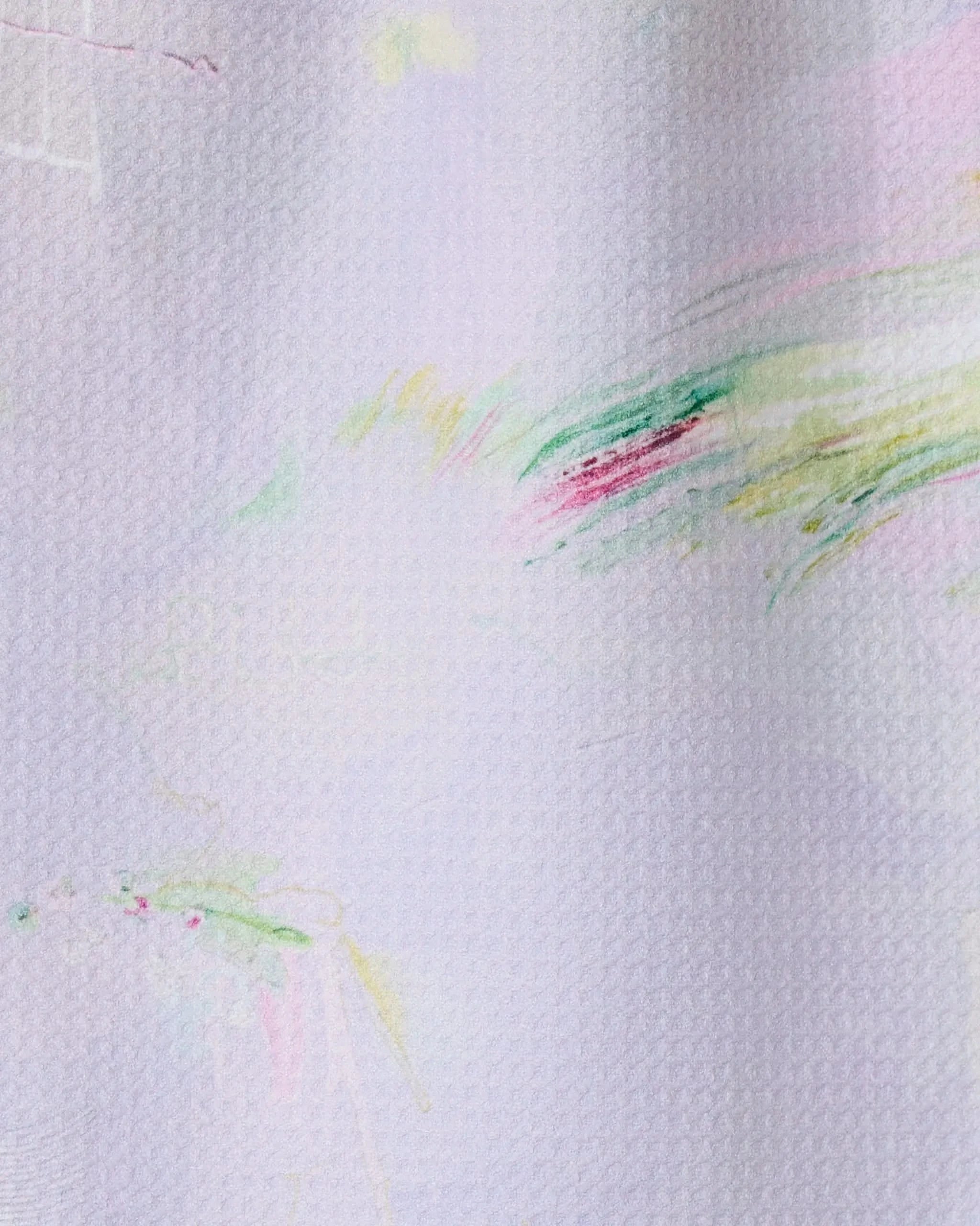 The GEOMETRY Province of Connacht towel features soft pastel pink, yellow, green, and red abstract brush strokes on a white textured fabric. Made from recycled materials, its ultra-absorbent and stylishly blends color across its surface.