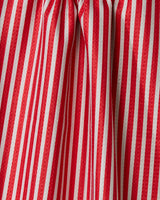 Close-up of red and green vertical stripes on the Geometry Red And Green recycled kitchen towel, showing visible creases and folds in the fabric.