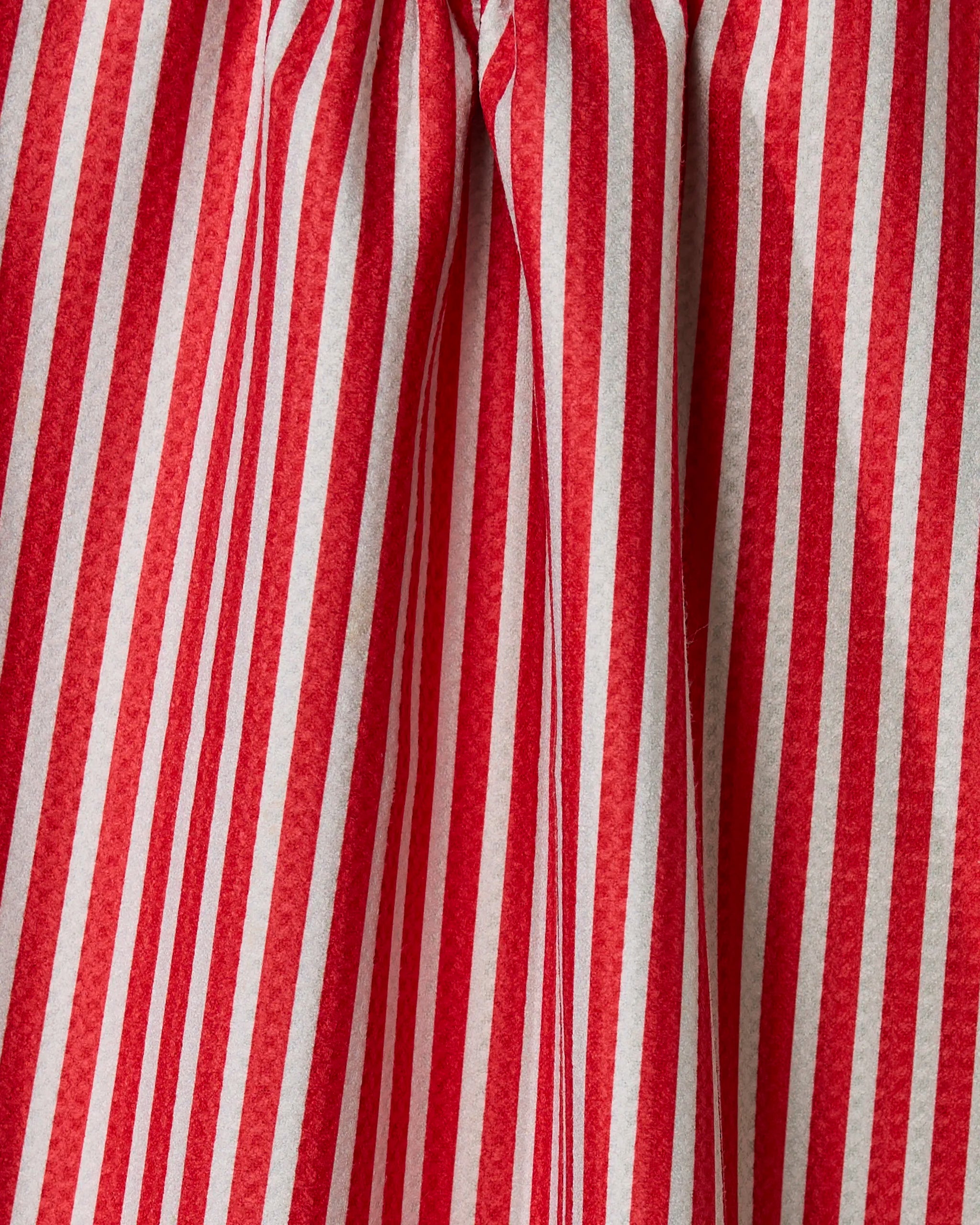 Close-up of red and green vertical stripes on the Geometry Red And Green recycled kitchen towel, showing visible creases and folds in the fabric.