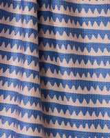 The Geometry Lav tea towel features quick-drying fabric with evenly spaced horizontal wavy blue lines on a light beige background, combining style and practicality for everyday use.