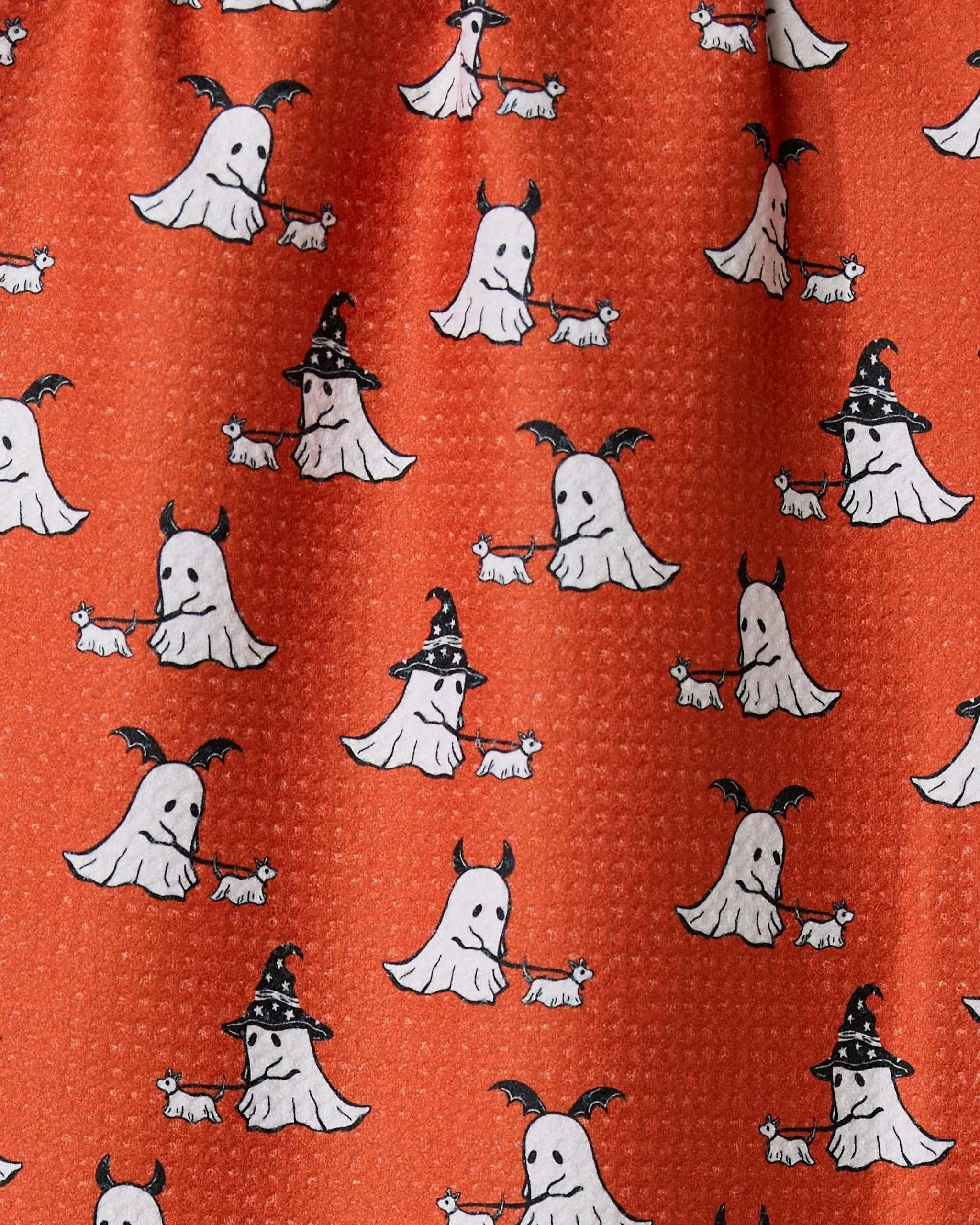 Geometry’s Spooky Ghost Walk Orange bar towel features playful white ghosts—some in witch hats or bat wings—and little white dogs on an orange background, crafted from ultra-absorbent recycled materials for eco-friendly style.