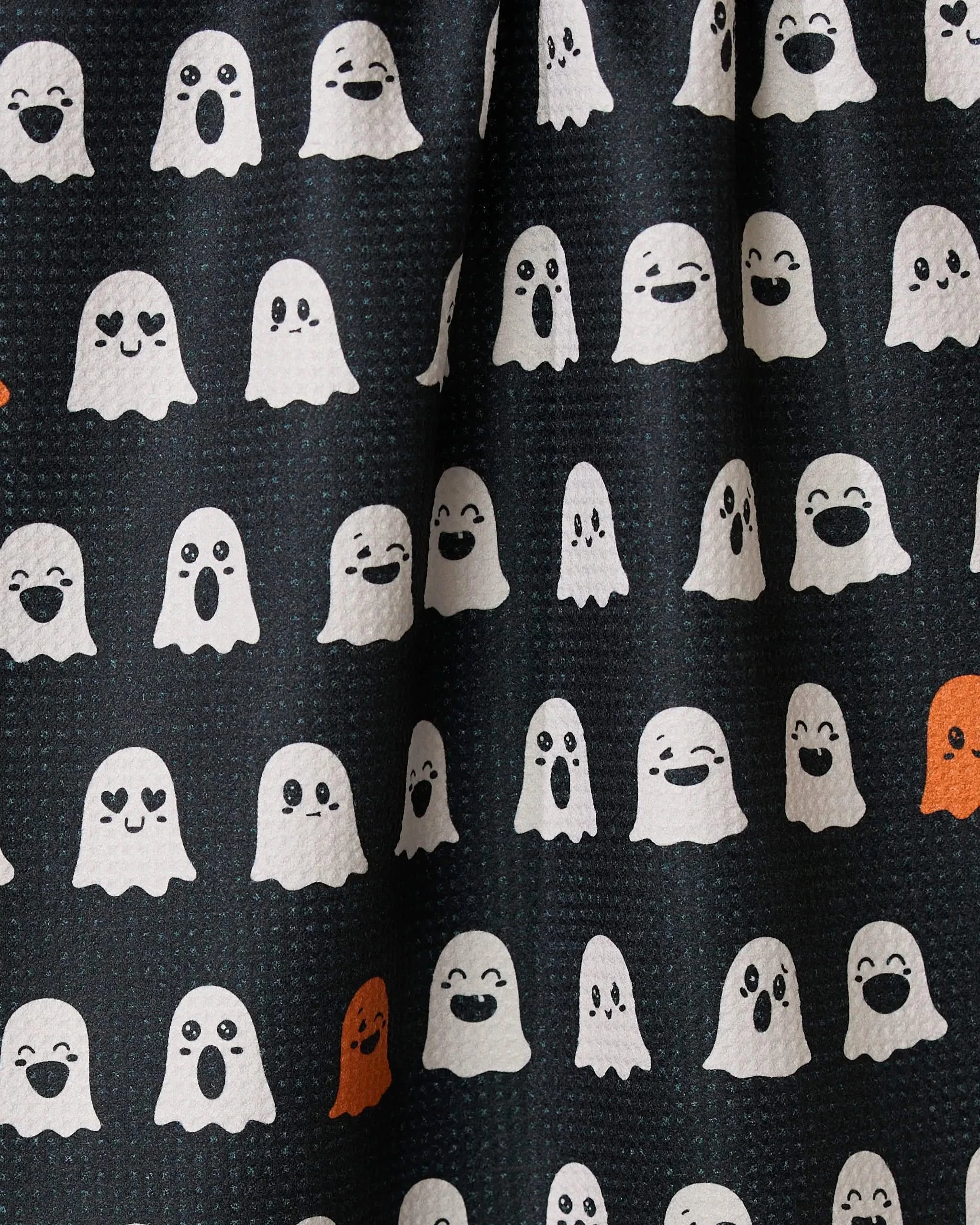 The Geometry Emotional Boos tea towel is a black and white kitchen accessory featuring playful white ghosts, adding a stylish and spooky touch to your space.