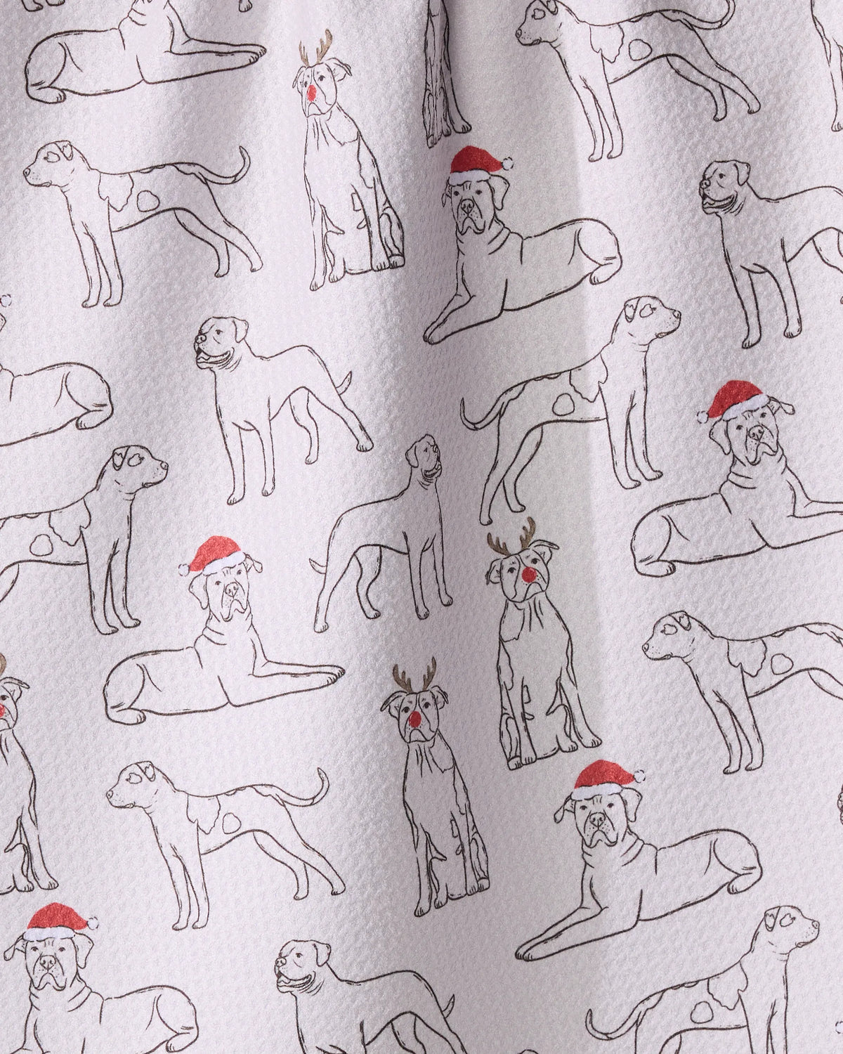 The Geometry Festive Bulldogs tea towel features line drawings of dogs in Santa hats and antlers, adding cheerful holiday style to your kitchen.