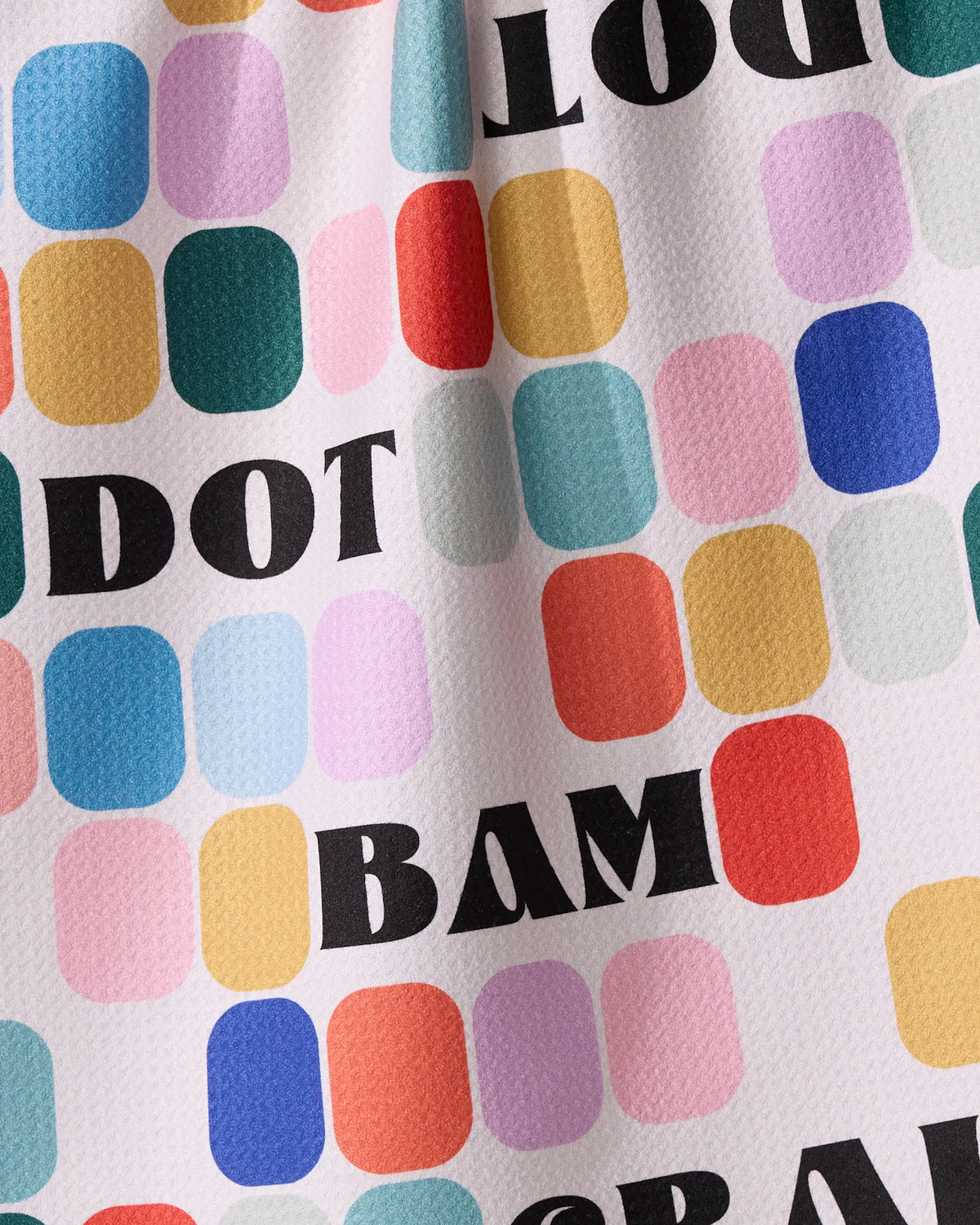 Tile Talk features a geoweave fabric pattern of colorful rounded rectangles on a light background, interspersed with the black text DOT and BAM.