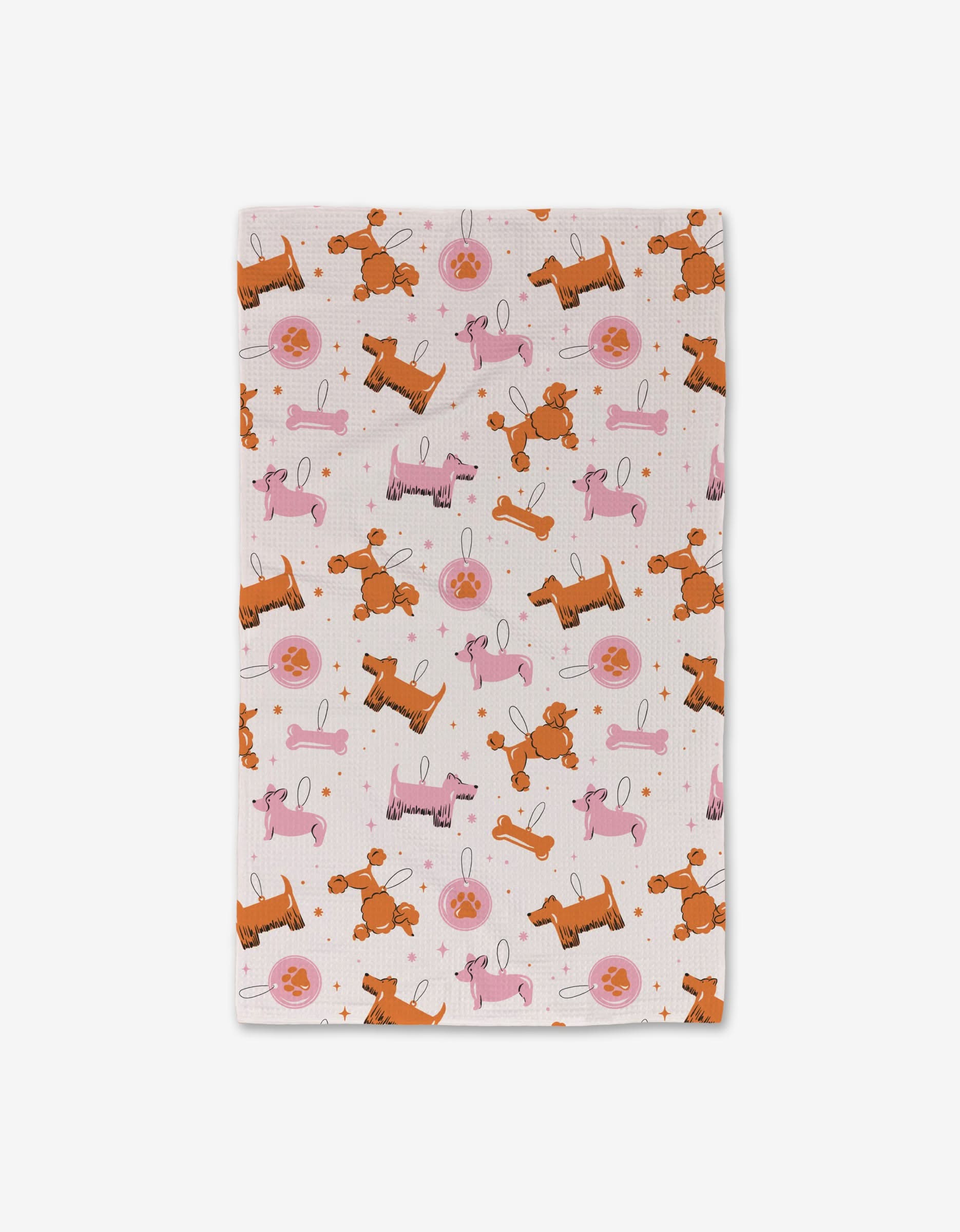 The Megan Roy Dog Ornaments hand towel is ultra-absorbent, rectangular, and white, featuring a repeating pattern of pink and orange cartoon poodles with pink balls on a plain background. The towel is neatly folded.