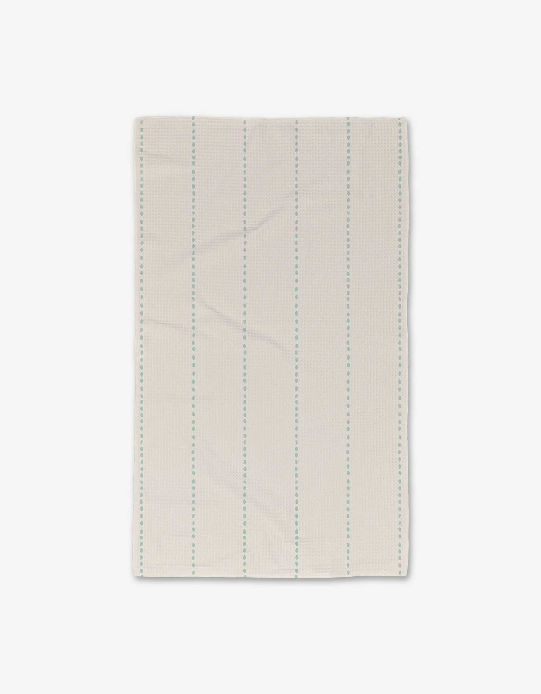 The GEOMETRY Dotted Dunes Luxe Hand Towel features thin, evenly spaced vertical blue-green dashed lines on a solid white background, made from ultra-absorbent recycled materials.