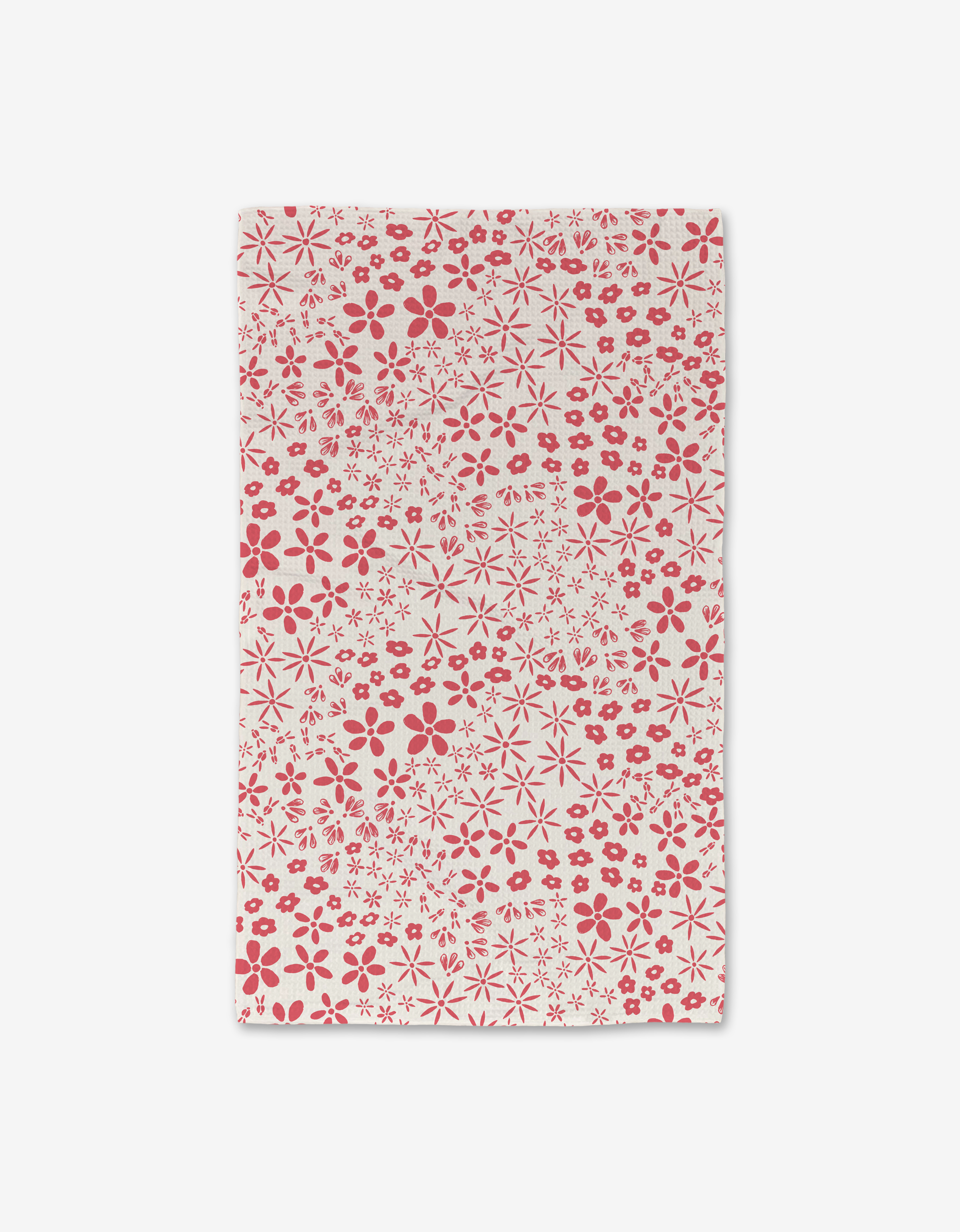 The Field of Flowers Luxe Hand Towel by Hufton Studio is a white rectangular towel with an even pattern of small and medium red flowers, made from ultra-absorbent recycled materials.