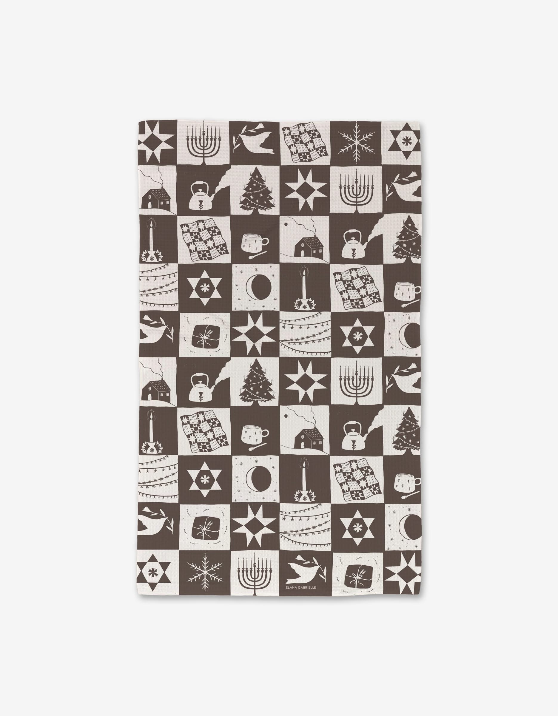 The Holiday Treats cloth by Elana Gabrielle features a brown and white checkered pattern with menorahs, Christmas trees, doves, stars, and presents. Made from recycled materials, it offers a festive and eco-friendly touch for the winter holidays.