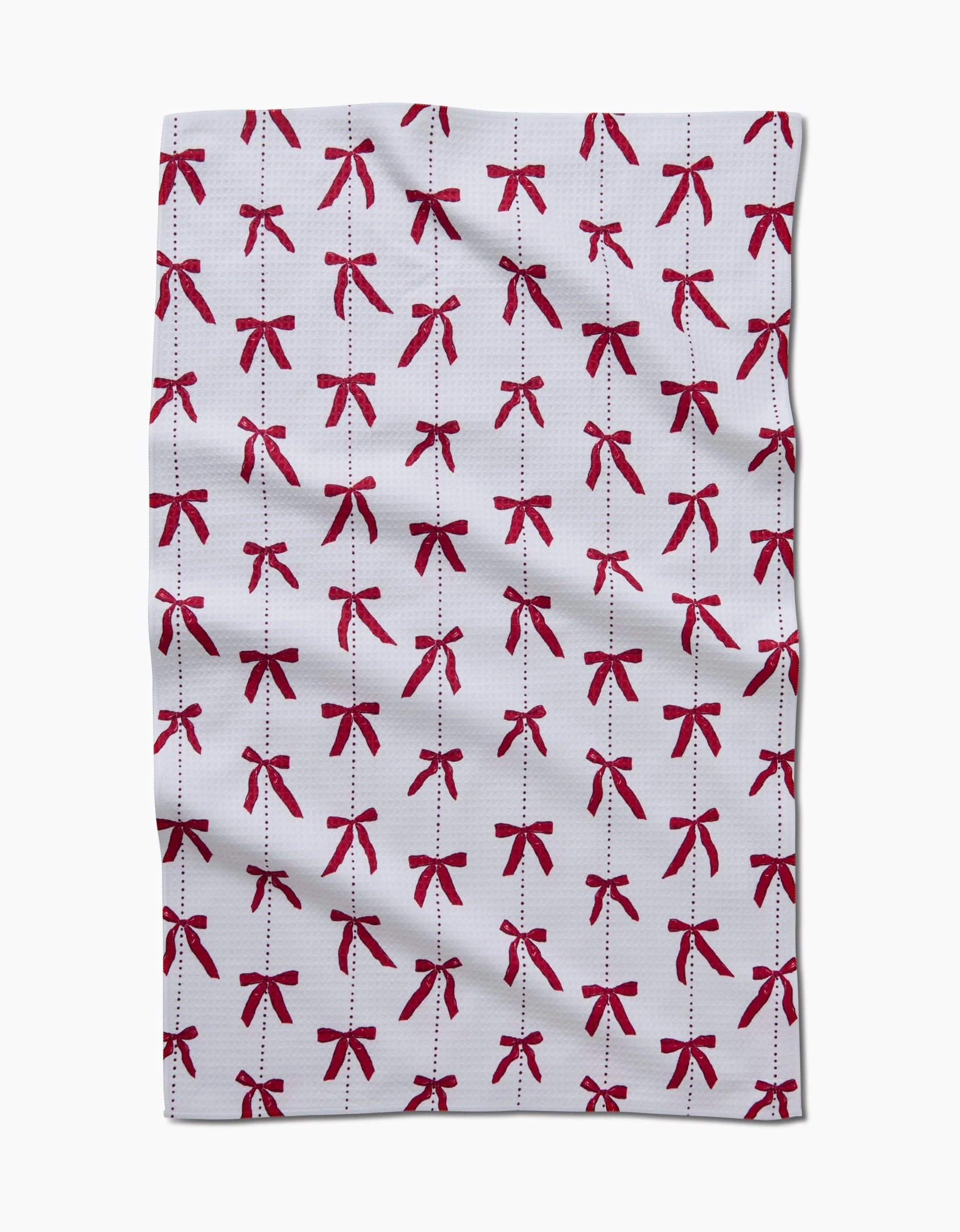 The Little Bows And Pearls hand towel from Hufton Studio features red bows and Geoweave technology for a soft, quick-drying touch.